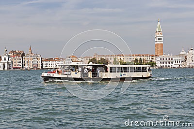 Water bus sails in Venice lagoon, Italy. Editorial Stock Photo