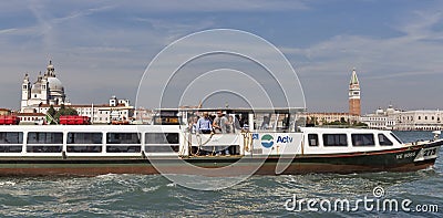 Water bus sails in Venice lagoon, Italy. Editorial Stock Photo