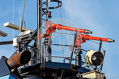 Water cannons aboard on a fire boat Stock Photo