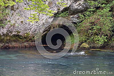 The water and the cave on the Kolpa river in Slovenia Stock Photo