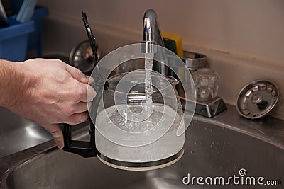 Water into the coffee pot Stock Photo