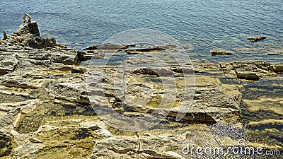 The water comes to the rocks, the tide.n Stock Photo