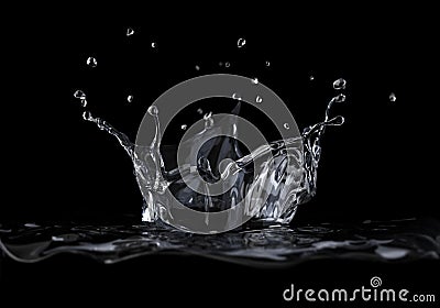 Water crown splash viewed from a side, on black background. Stock Photo