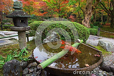 Water dipper on stone basin at Enkoji temple, Kyoto Stock Photo