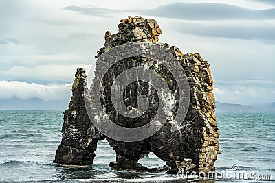 Water drinking lava formation in Huna bay, on northern Iceland Stock Photo