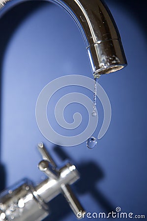 Water dripping from tap Stock Photo