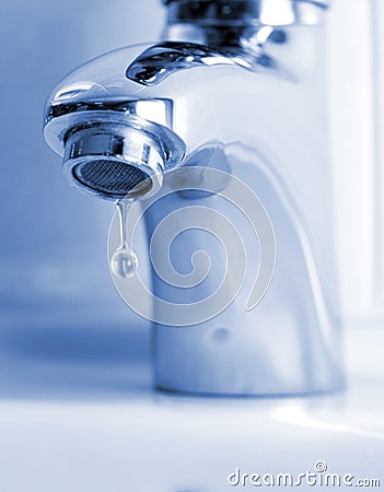 Water dripping from water faucet Stock Photo