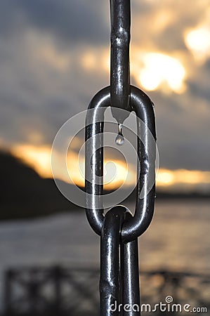 Water drop on an anchor chain. Stock Photo