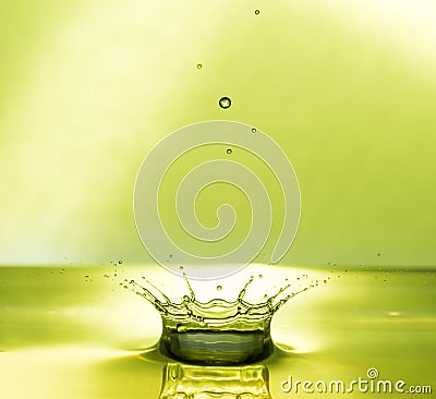 Water Drop Collisions Macro Photography with green background Stock Photo
