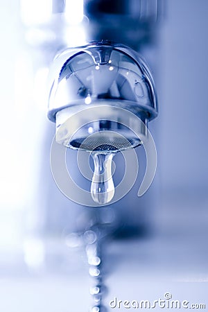 Water drop from a faucet Stock Photo