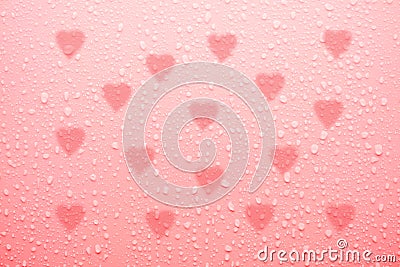 Water drop on pink love surface Stock Photo