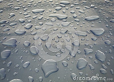 Water drop of rain on a blue car background Stock Photo