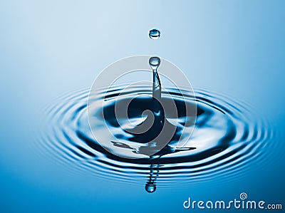 Water Drop and ripple in the water Stock Photo