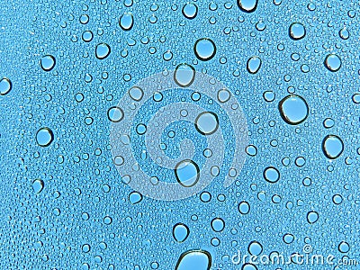 Water droplets on glass, blue sky Stock Photo