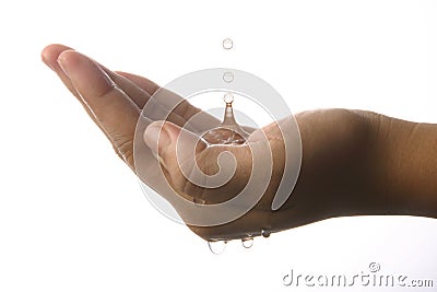 Water dropping on hand Stock Photo