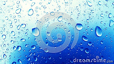 Water Drops background on the Blue glossy surface, Rain droplets Stock Photo