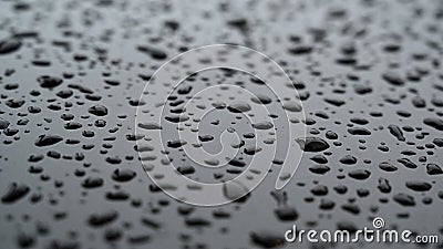 Water drops on a black varnished or lacquered surface Stock Photo