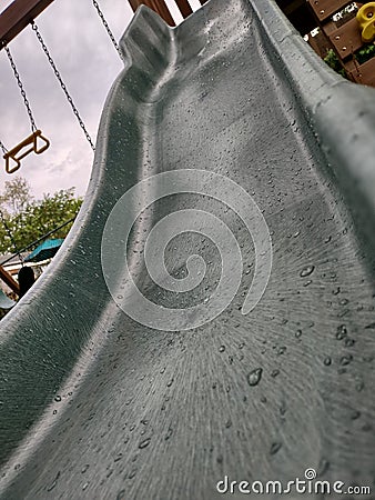 Water drops on child slide Stock Photo