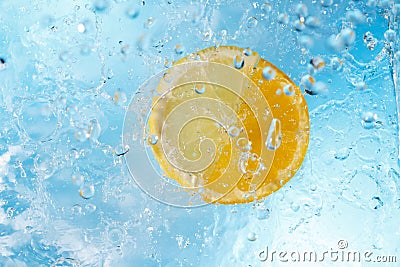 Water drops falling on lemon and orange Stock Photo