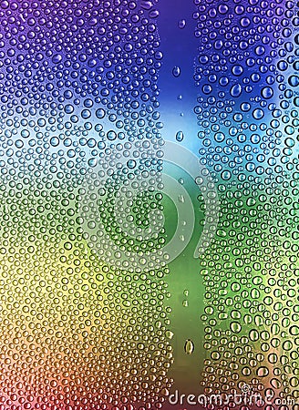 Water drops on glass rainbow Stock Photo