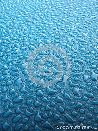 Water drops over blue plastic material Stock Photo