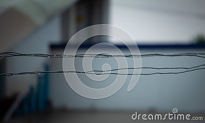 Water drops over the metal wires used for drying clothes Stock Photo