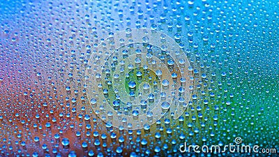 Water drops. Texture of the drops. Abstract gradient background. Multicolored dark iridescent gradient. Heavily textured image. Stock Photo