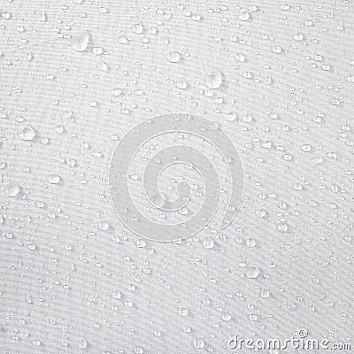 Water drops on waterproof fabric background. Raindrops on white umbrella Stock Photo