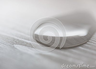 Water drops on white wooden surface made from larch wood covering by oil with wax. Stock Photo