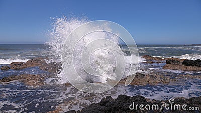 Water erupting from Thor`s Well - a natural blow hole at Oregon coast near Yachats Stock Photo