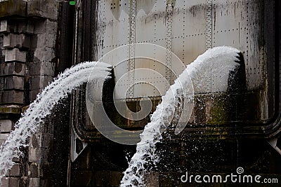 Water escaping due to overpressure Stock Photo