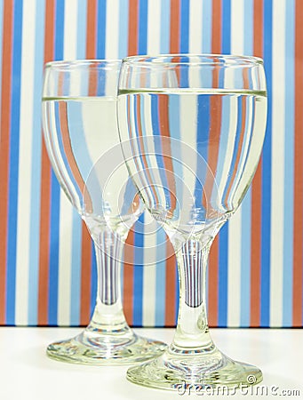 Water filled wine glasses abstractly placed. Stock Photo