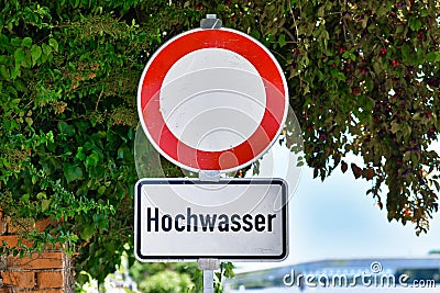 Water flood sign at German Rhine river saying `Hochwasser` Stock Photo