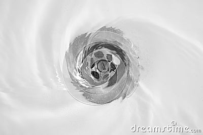 Water flow into drain Stock Photo