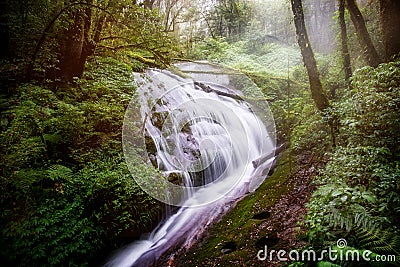 Water flowing at a beautiful waterfall at Inthanon nation park, Chiangmai, Thailand. Stock Photo