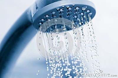 Water flowing from metal shower Stock Photo