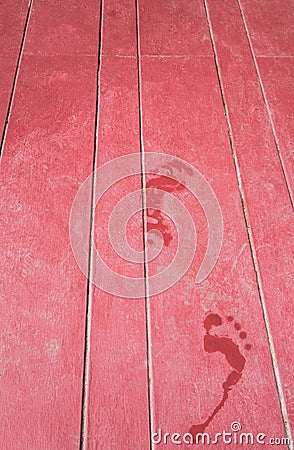 Water footprint on maroon wooden floor Stock Photo