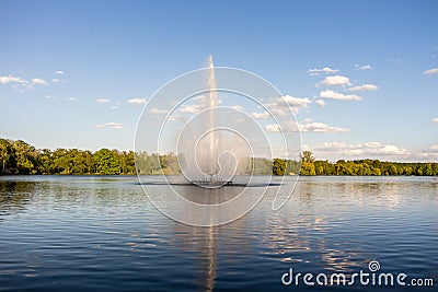 Water fountain at the swan pond in Zwickau Stock Photo