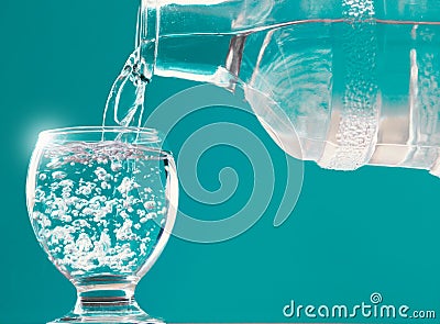 Water glass and water bottle with water filling Stock Photo