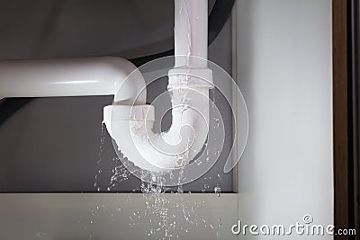 Water Is Leaking From The Pipe Stock Photo