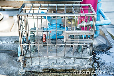 Water Meters in cage Stock Photo