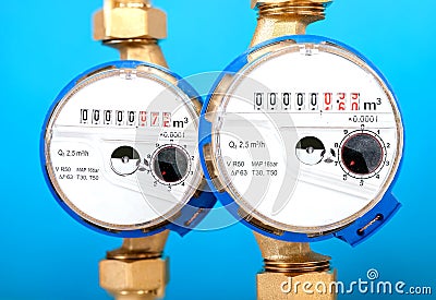 Water meters, sanitary equipment on blue background. Stock Photo