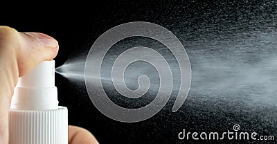 Water mist splash bottle isolated on black background. Spray liquid aerosol for perfume. Stock Photo