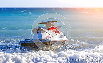 Water motorcycle in blue sea on clear sunny day. Water bike on waves of sea Stock Photo
