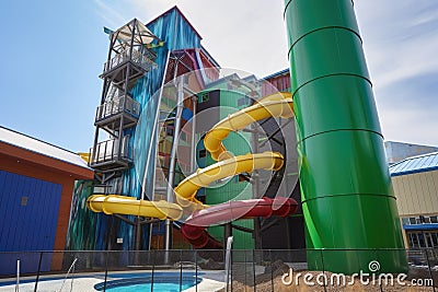 water park with flume water slide, twisting and turning its way down the side of the building Stock Photo