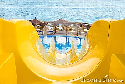 Water park, top yellow water slide, Closeup Stock Photo