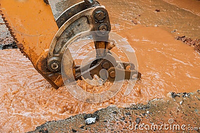 Water pipe break, leaking from hole in a road Stock Photo