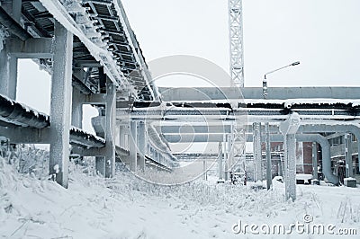 Water pipelines with electric cables are on above-ground piperack at winter season Stock Photo
