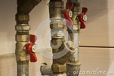 Water pipes and valves connected to heating furnace Stock Photo