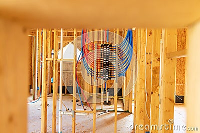 Water plumbing manifold for water distribution in new home construction. Selective focus Stock Photo